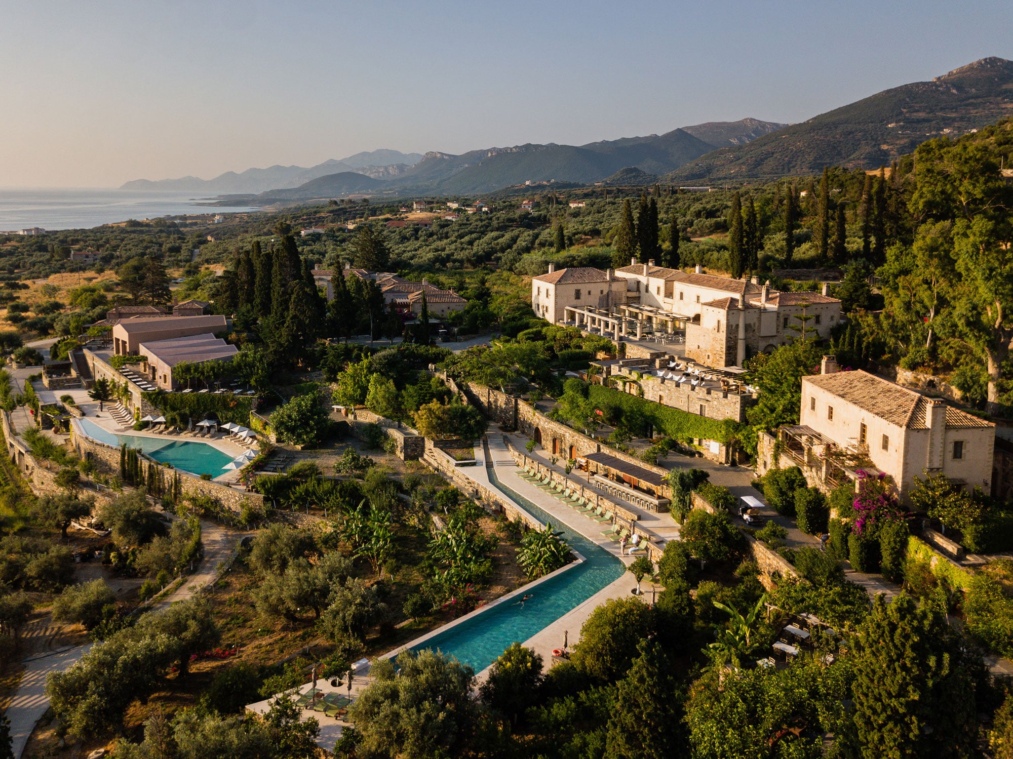 Kinsterna Hotel, graced by soft morning light, a soulful luxury hotel in the Peloponnese that prioritizes rhythm, connection and slow travel.